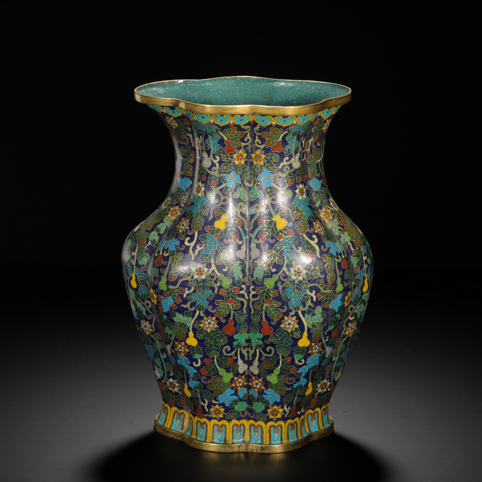 QING DYNASTY COPPER CLOISONNE ENAMEL GOURD MANDAI PATTERN BEGONIA-STYLE VASE: H:27cm (10.63in) W:19cm (7.48in) Weight:1520g (3.35lb)This is a Qing Dynasty cloisonne enamel vase, featuring a begonia-shaped form with gilded rim and foot and neat craftsmanship. The body is decorat