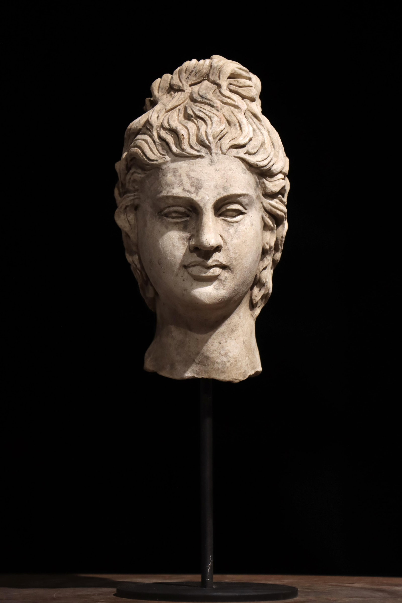 A 3TH-CENTURY ANCIENT GREEK STONE-CARVED HEAD: Total height: 35cm (13.78in) Net height: 21cm (8.27in)