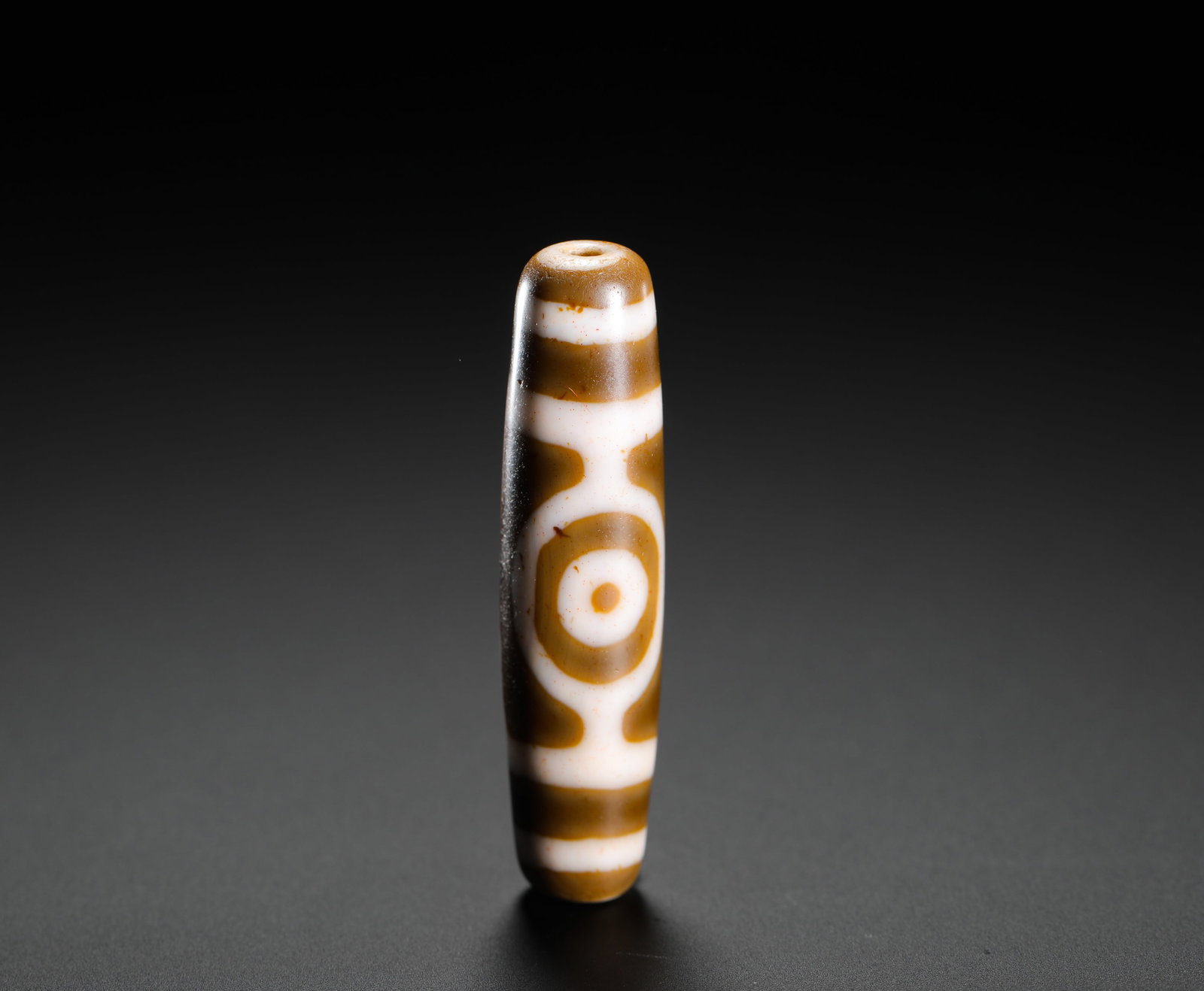 QING DYNASTY THREE-EYED SKY BEADS: H:5.2cm(2.05in)D:1.3cm(0.51in)Weight:10g(0.02lb)These objects originated from Tibetan culture, symbolizing protection and good fortune. The three-eye motif represents "fortune, prosperity, and longevi