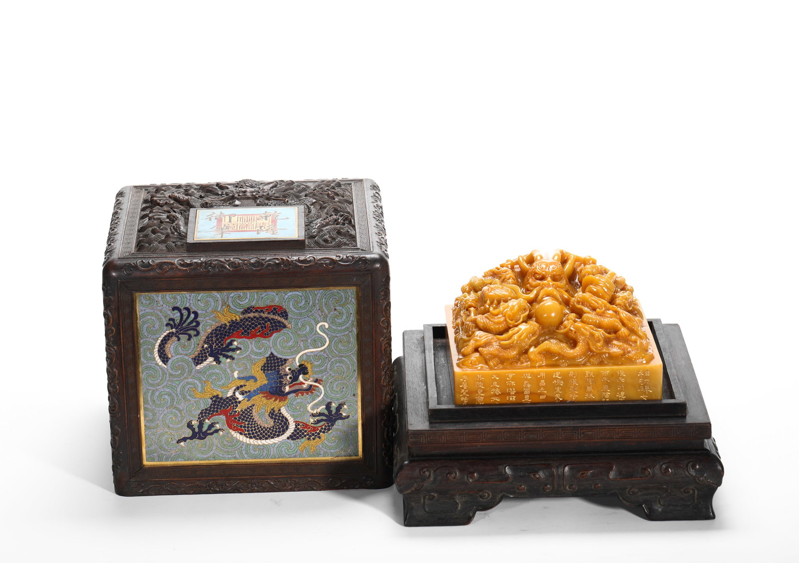 QING DYNASTY SHOUSHAN TIAN HUANGSHI NINE DRAGON KNOB IMPERIAL SEAL: H:27cm (10.63in) W:25cm (9.84in) Weight:8470g (18.67lb)Large tianhuang imperial square seal carved with clustered dragons, accompanied by zitan storage box inlaid with cloisonne dragon plaque.
