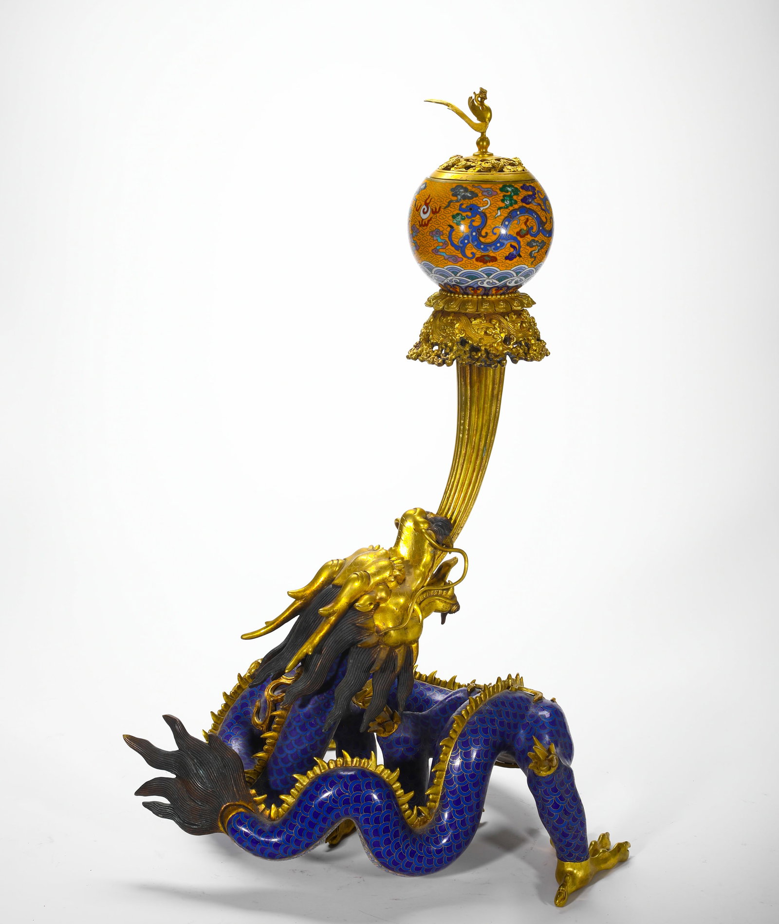 QING DYNASTY BRONZE GILDED CLOISONNE ENAMEL BLUE DRAGON WITH A PEARL IN ITS MOUTH SPHERICAL INCENSE: H:63cm (24.80in) W:38cm (14.96in) Weight:11980g (26.41lb)Cast gilt bronze censer with cloisonne-scaled dragon supporting globular incense sphere topped with phoenix finial.