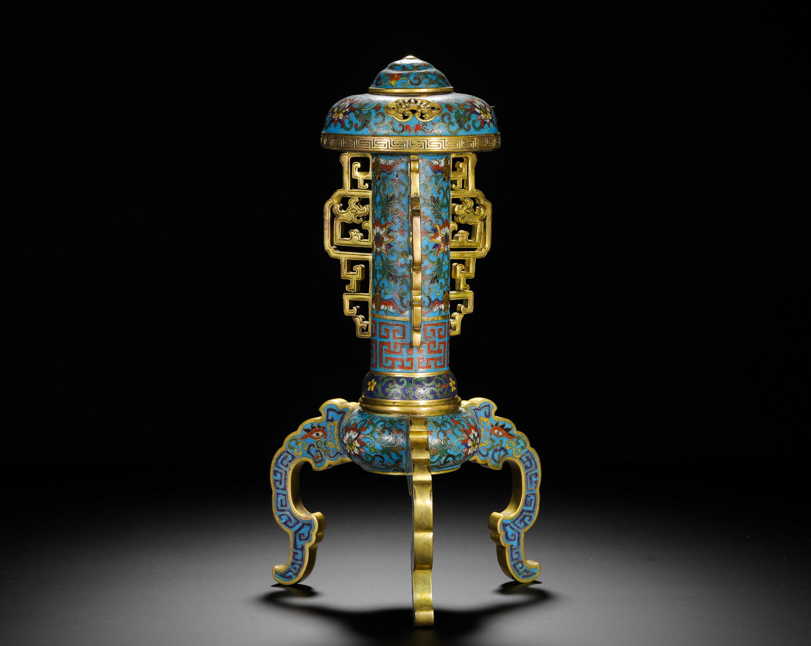 QING DYNASTY COPPER BODY CLOISONNE ENAMEL THREE-LEGGED OFFICIAL HAT-STYLE INCENSE BURNER: H:29cm (11.42in) W:14.5cm (5.71in) Weight:1590g (3.51lb)Gilt copper cloisonne censer decorated with scrolling floral, hollowed dragon flanks and three beast legs.