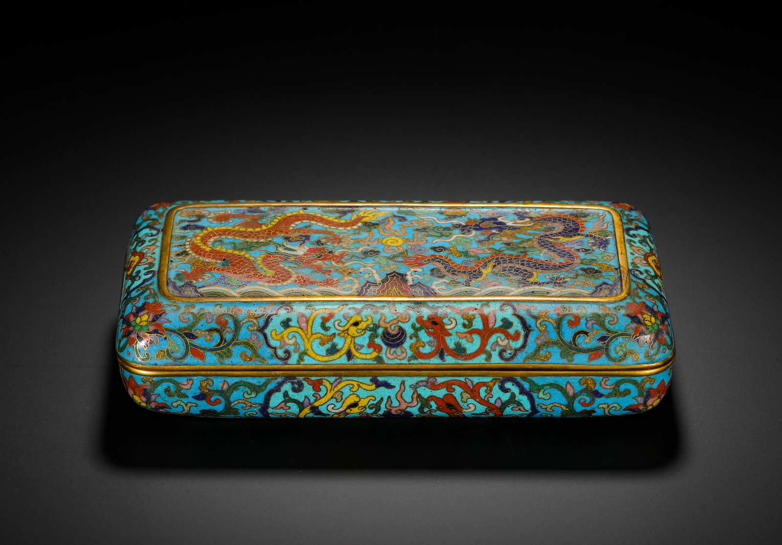 QING DYNASTY COPPER CLOISONNE ENAMEL DOUBLE DRAGONS PLAYING WITH A PEARL RECTANGULAR LID BOX: H:5cm (1.97in) W:20cm (7.87in) Weight:1080g (2.38lb)This is a Qing Dynasty copper-based cloisonne enamel covered box, rectangular in shape with gilded edges and neat craftsmanship. The lid is decorate