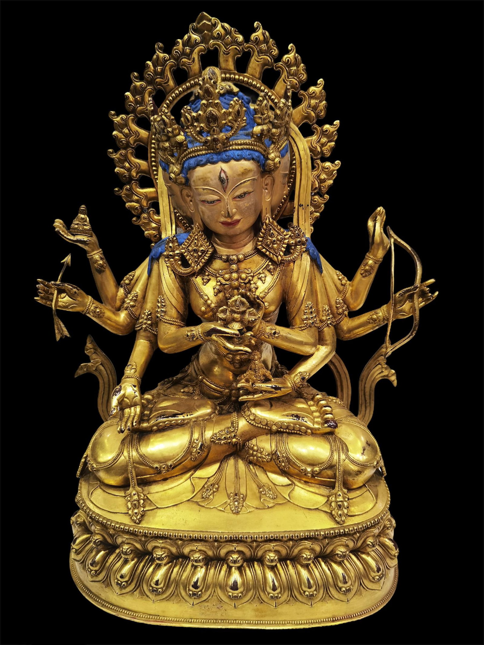 A Gilt Bronze Guanyin Statue: A Gilt Bronze Seated Guanyin Statue. Height: 14"