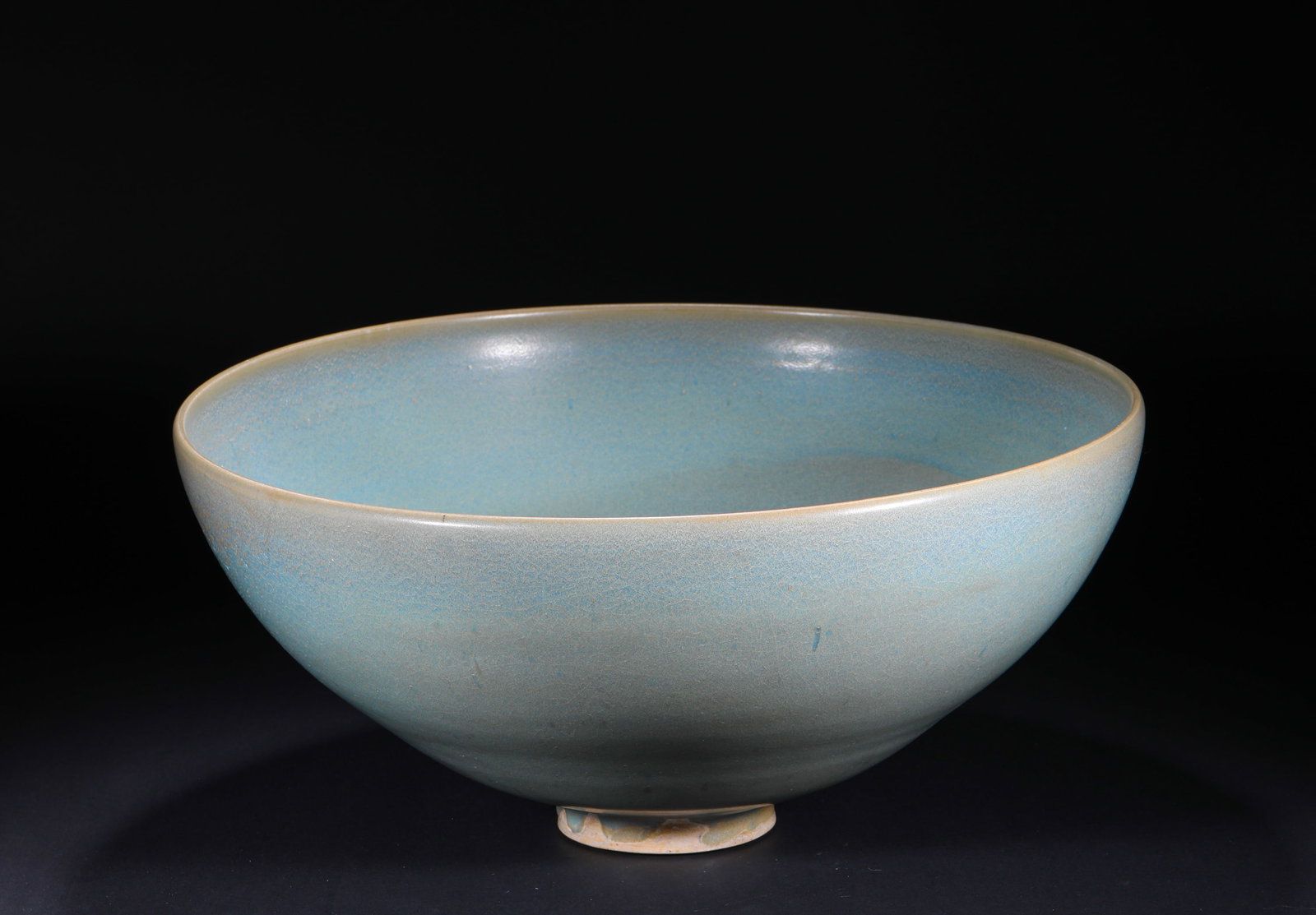 YUAN DYNASTY JUN KILN SKY BLUE GLAZED LARGE BOWL: H:18cm(7.09in) D:42cm(16.54in)This bowl is a classic daily-use display piece of Jun Kiln, featuring a wide mouth, curved belly and regular foot ring. The whole body is covered with sky-blue glaze,