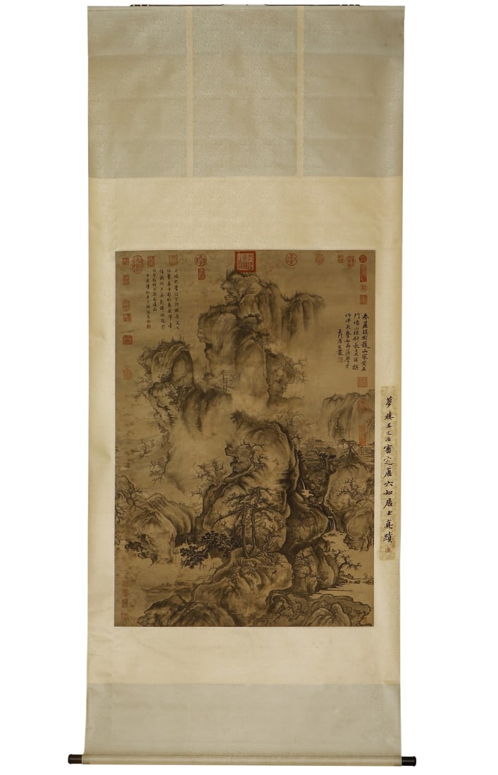 A VERTICAL SCROLL OF LANDSCAPE BY TANG YIN OF THE MING DYNASTY (1470-1524): H:145cm(57.09in) W:99.5cm(39.17in)Vertical landscape scroll by Tang Yin, featuring lush textured rock formations and distant misty scenery, covered with imperial collection seals and an original vinta