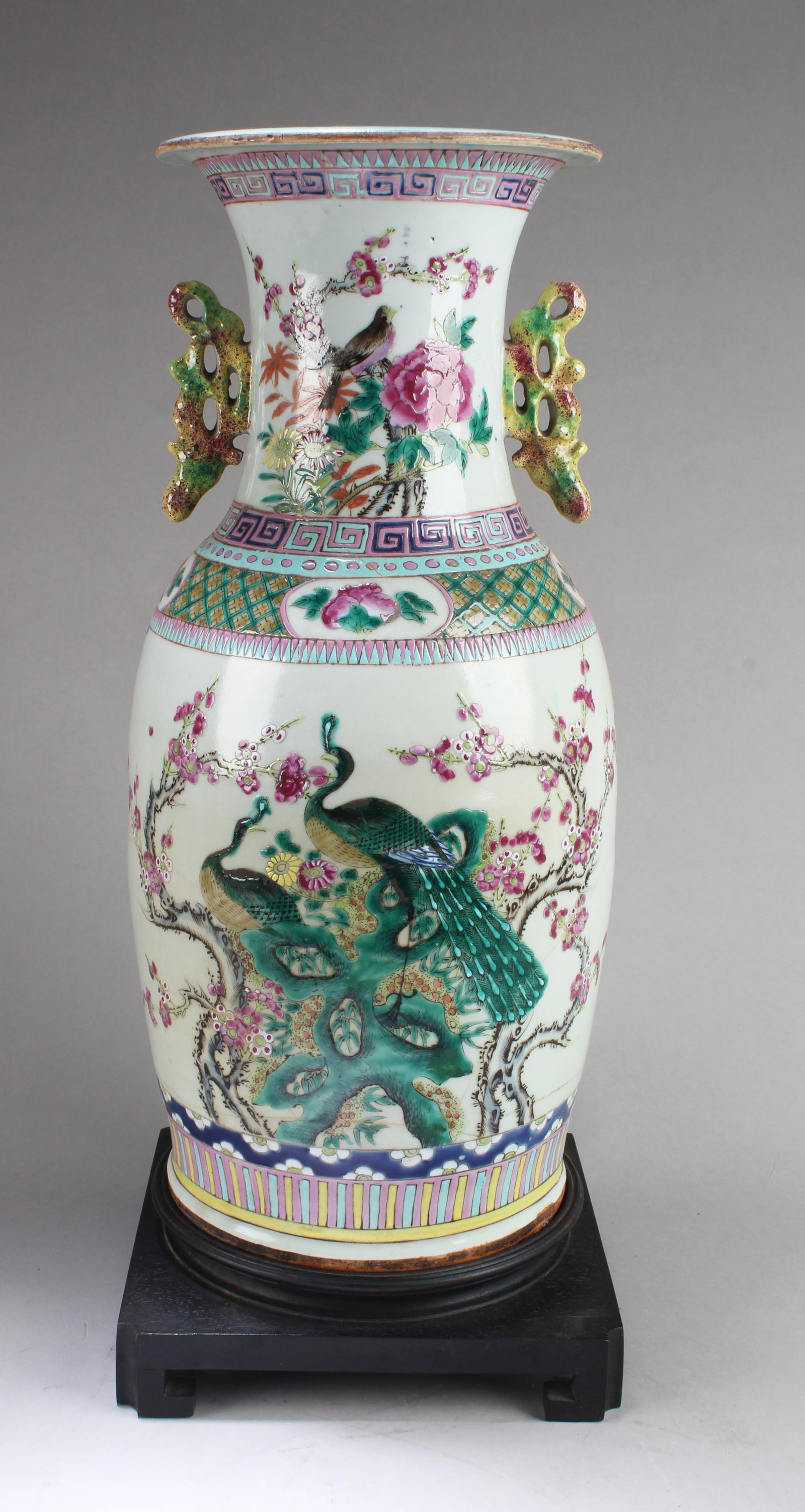 Chinese Porcelain Vase with Twin Handles: Chinese Porcelain Vase with Twin Handles. Come fitted with stand. Height: 18.25"