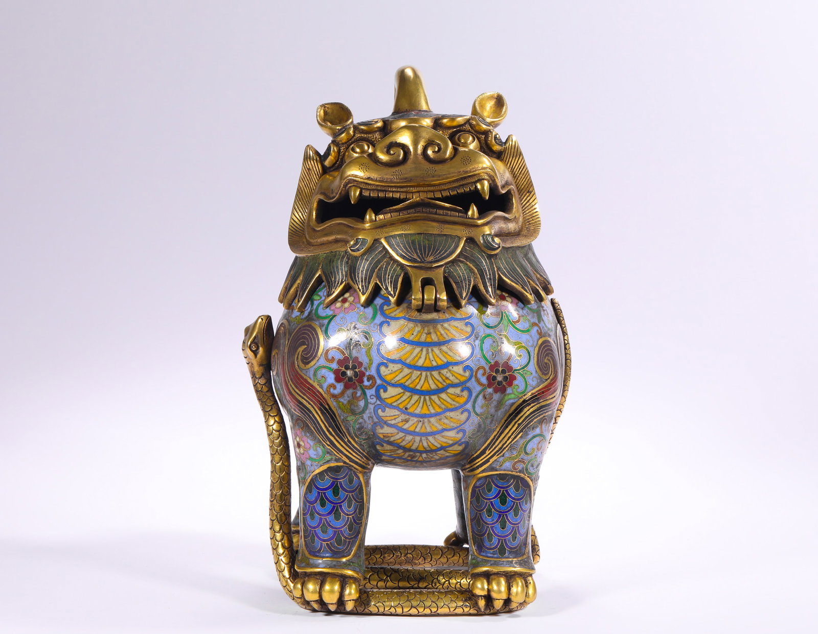 QING DYNASTY COPPER BODY CLOISONNE ENAMEL GILDED AUSPICIOUS BEAST INCENSE: H:26.0cm(10.24in) W:17.0cm(6.69in) Weight:4350g(9.59lb)This incense burner is a classic auspicious masterpiece of Qing Dynasty cloisonne art. Cast with a bronze body and inlaid with cloisonne enamel, 