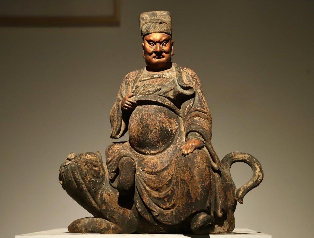 A WOODEN STATUE OF ZHAO GONGMING FROM THE SONG DYNASTY: H:39cmL:33cmW:18cmWeight:8000g