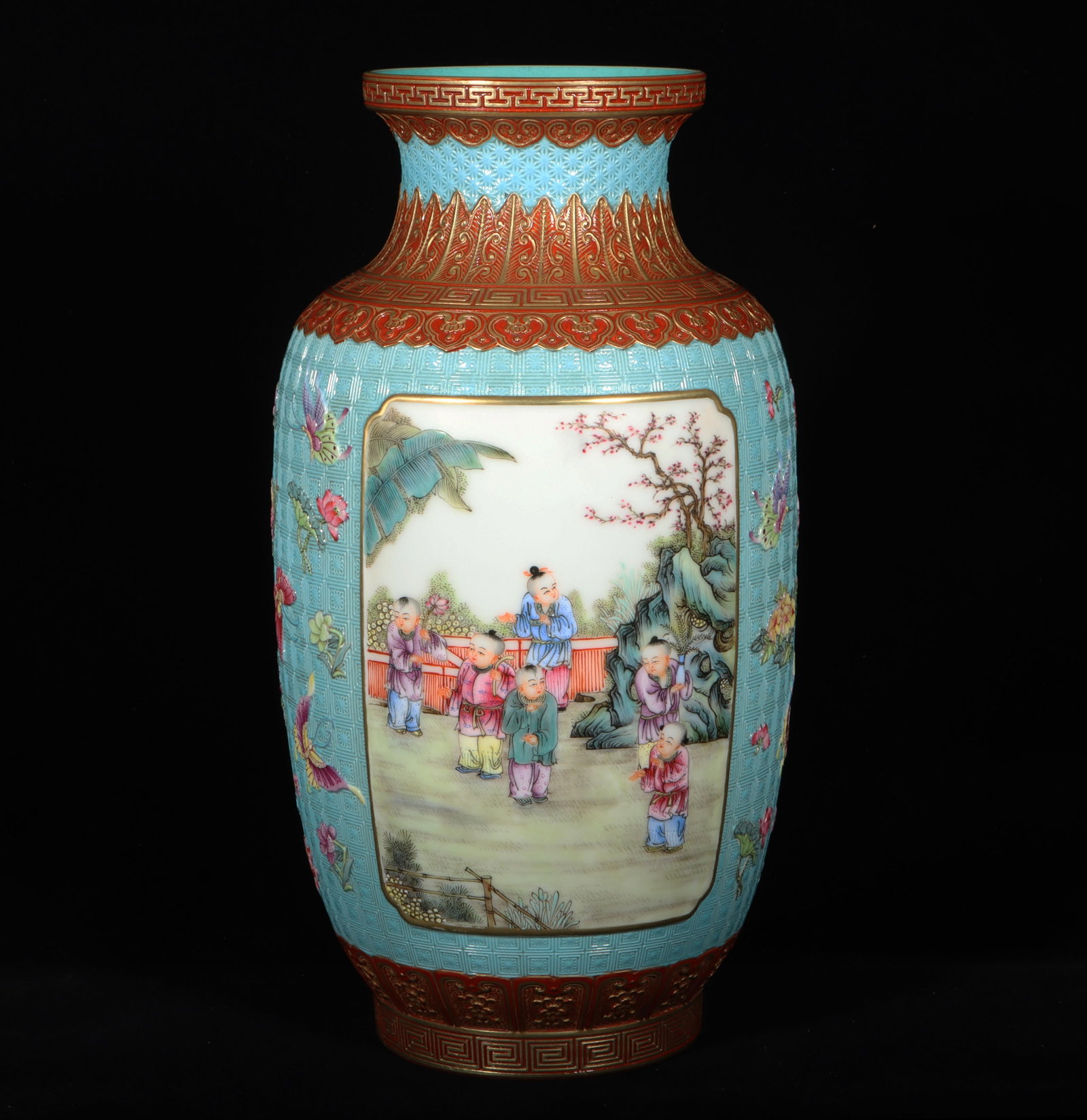 A Chinese Fencai Figure Vase: A Chinese Fencai Figure Vase. "Qianlong" mark at base. Dimensions: 6.3" x 12".
