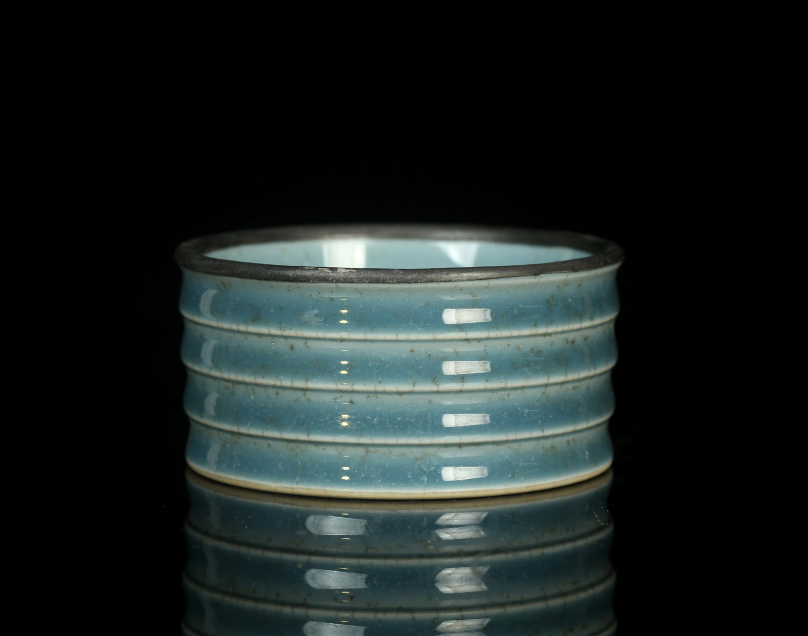 A Round Porcelain Holder: A Round Porcelain Holder. 'QianLong' mark at base. Height: 5 cm Diameter: 11 cmProvenance: From Dr Yang of Monterey Park, California