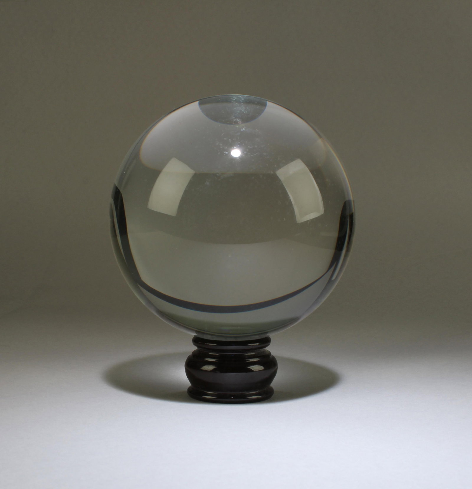 A Crystal Ball: A Crystal Ball. Comes fitted with a base. Diameter: 6"