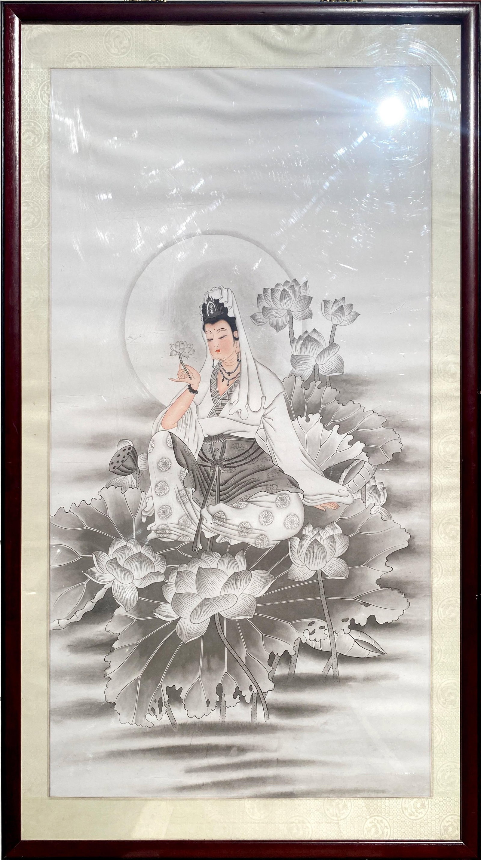 A Framed Guanyin Painting: A Framed Guanyin Painting. Length: 34.25" Height: 59.25" (Frame)