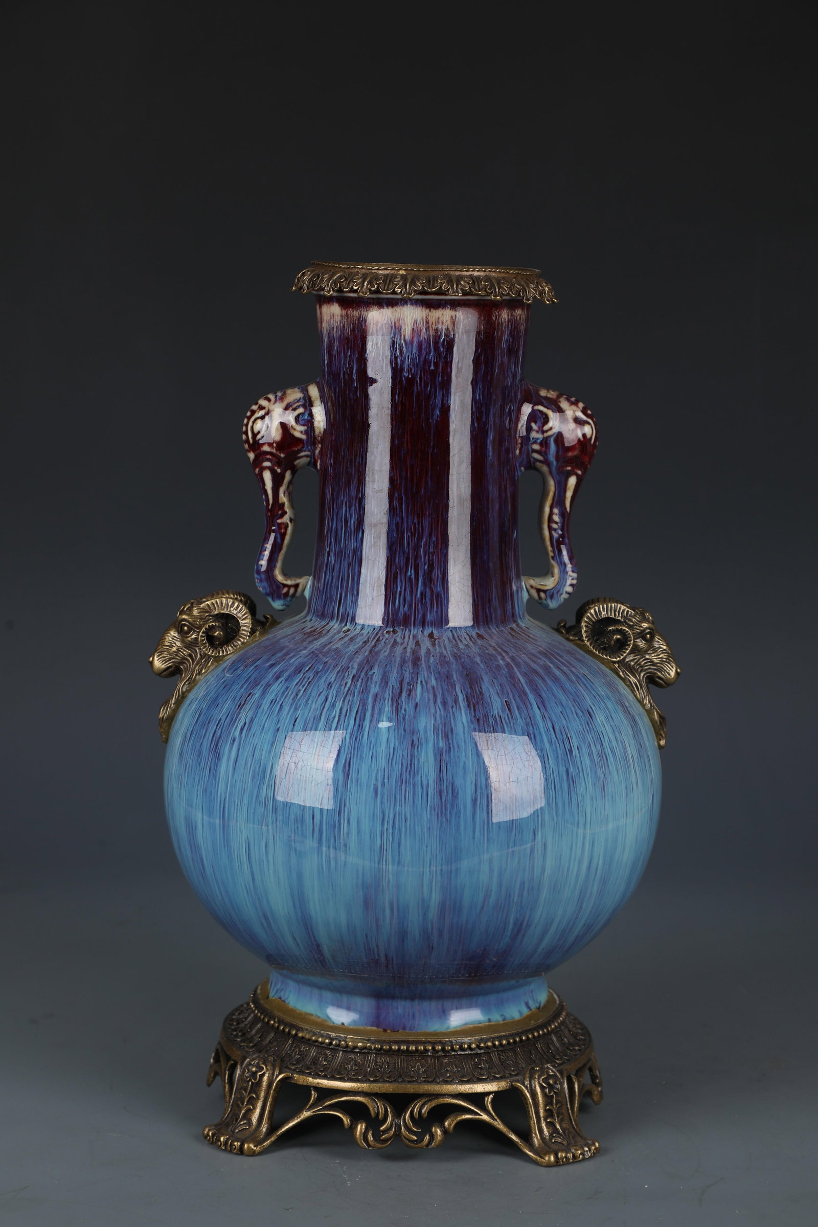 A Porclain Vase with Bronze Accents: A Porclain Vase with Bronze Accents. Dimensions: 14.5" x 9".