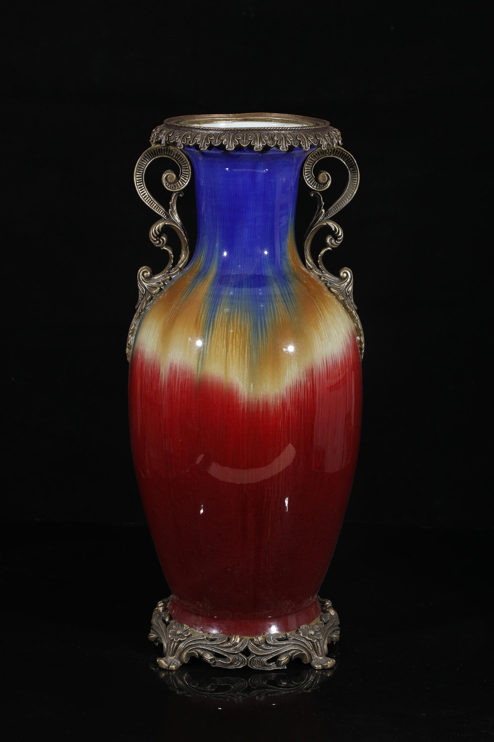 A Porcelain Vase: A Porcelain Vase, with brass ormolu. 'QianLong' mark at base. Height: 18.1" Diameter: 7.5" (Widest)