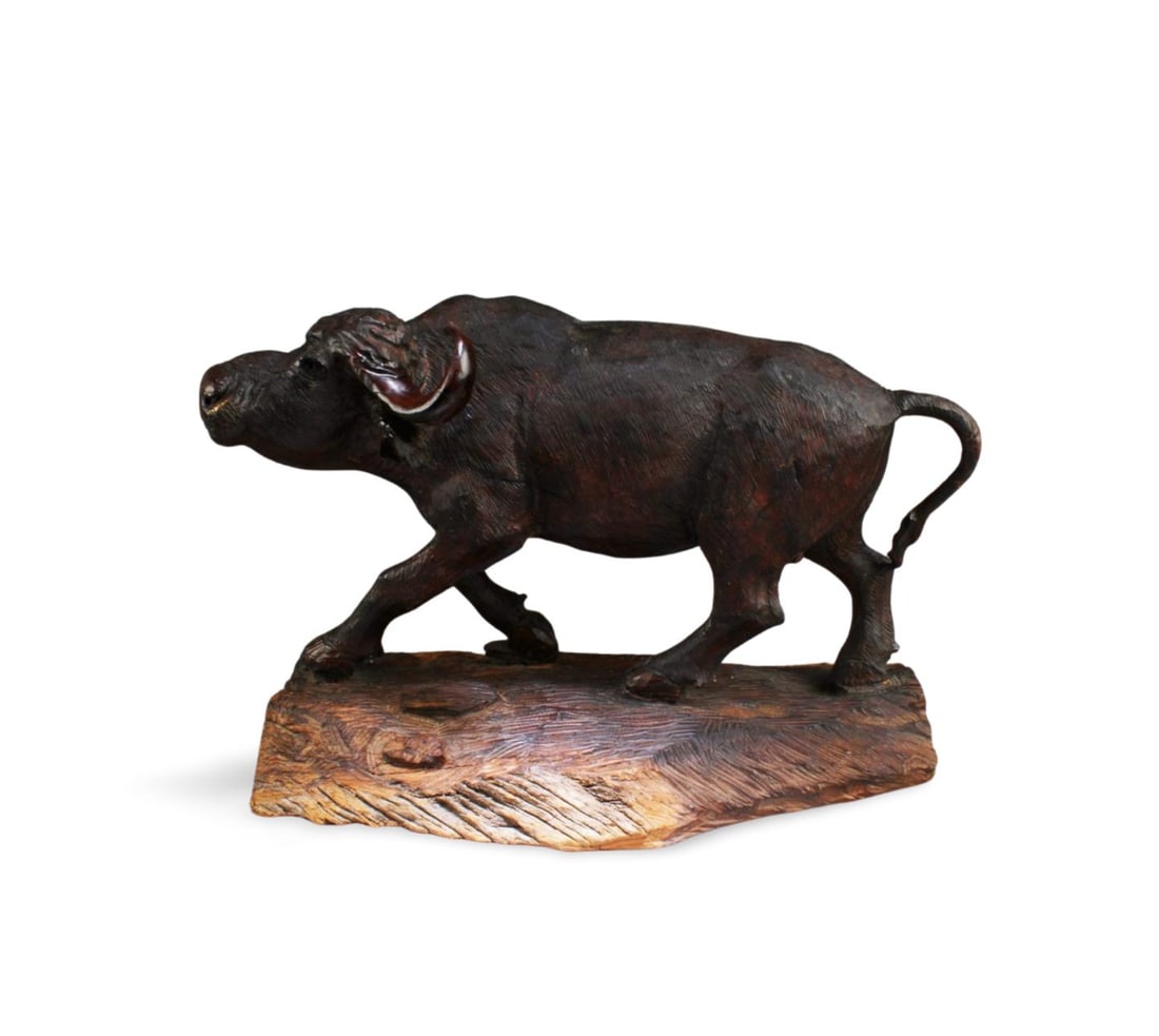 A Carved Wooden Water Buffalo Figurine: A Carved Wooden Water Buffalo Figurine. Length: 16.75" Height: 11.25"