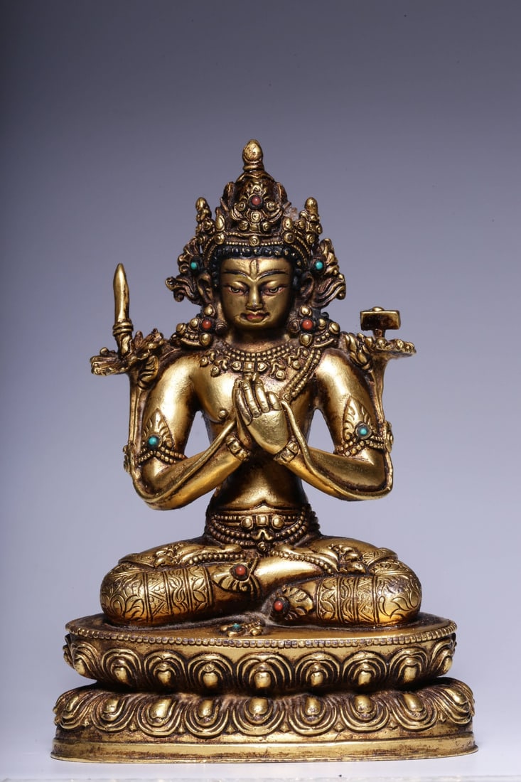 A Gilt Bronze Manjushri Statue: Dimensions: 4.92in x 2.64in x 2.76in; Weight: 1.48lbs.