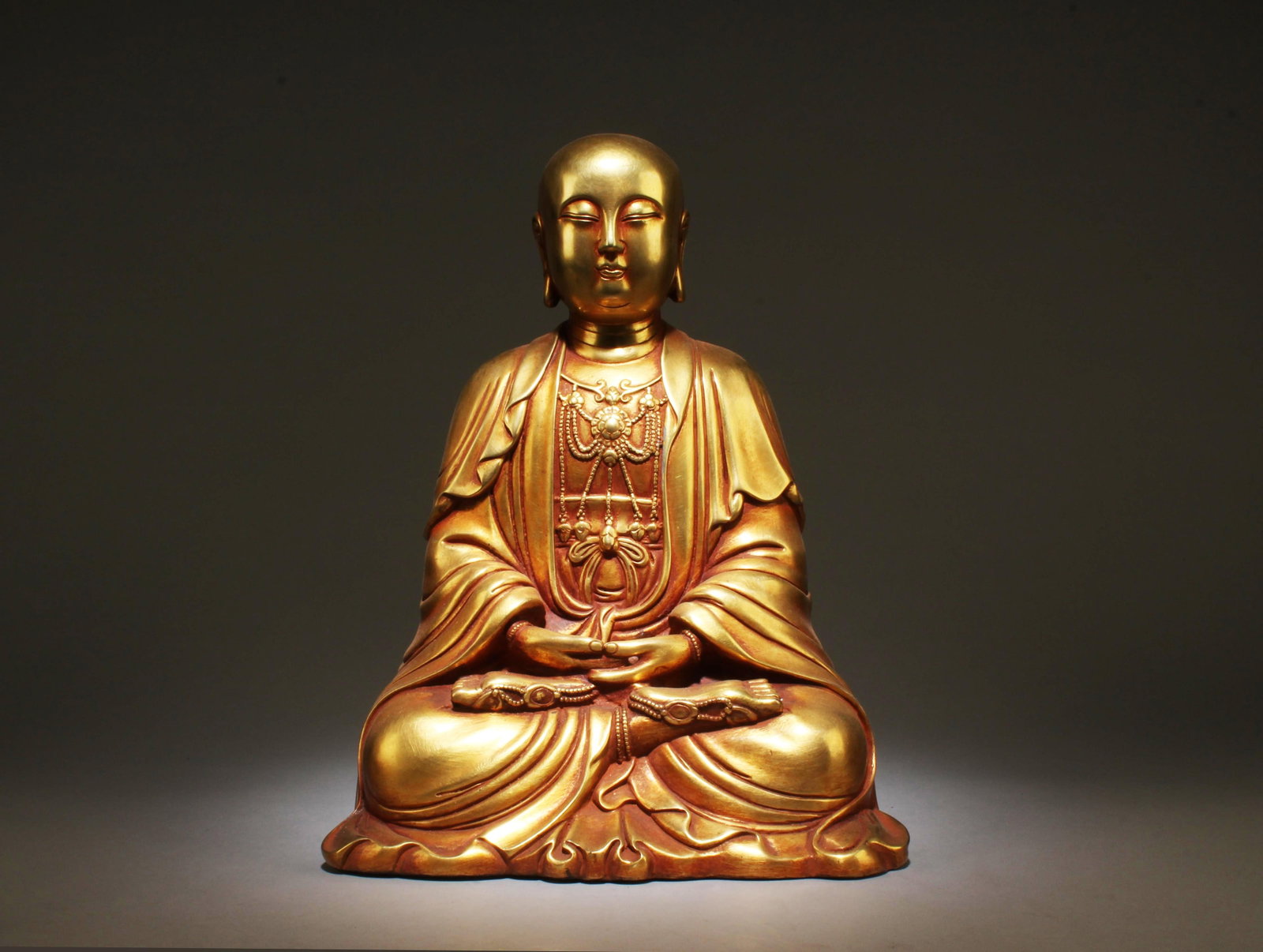 A Sitting Gilt Bronze Bodhisattva Statue: A Sitting Gilt Bronze Bodhisattva Statue. Dimensions: 13" x 10".