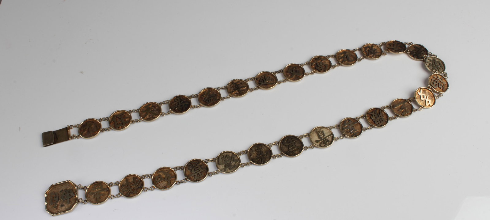 A Gilt Bronze Waist Belt: A Gilt Bronze Waist Belt. Length: 34.25"