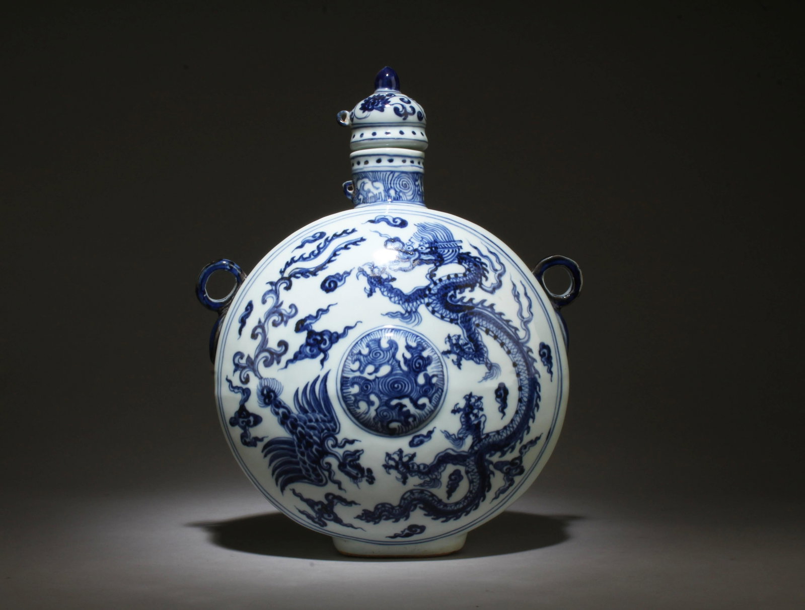 A Blue and White Moonflask Vase: A Blue and White Moonflask Vase. Dimensions: 13" x 10.5".
