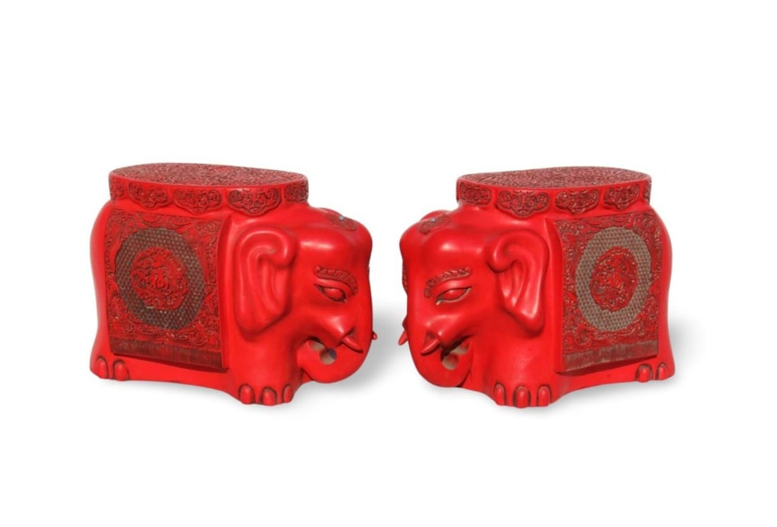 A Pair of Chinese Red Elephant Stools: A Pair of Chinese Red Elephant Stools. Dimensions: 21" x 10x 13.75".