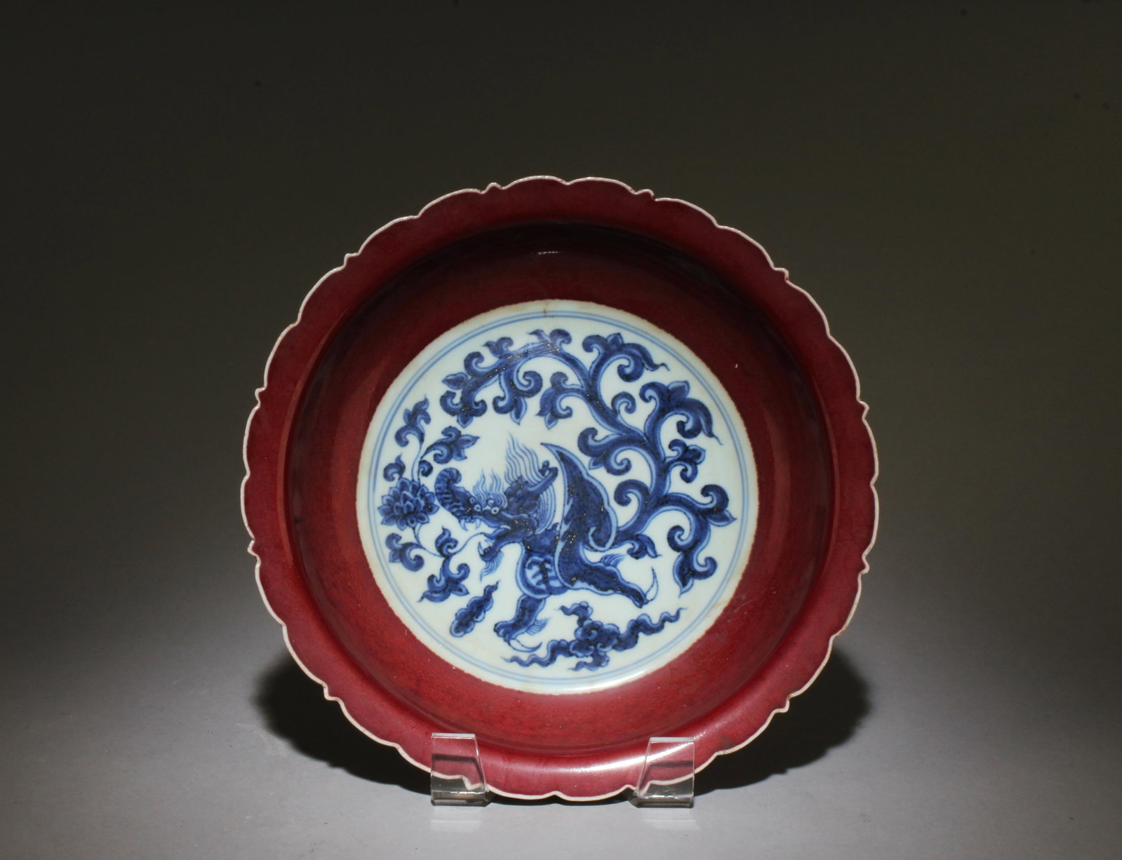 A Blue, White, and Red Qilin Plate: A Blue, White, and Red Qilin Plate. Dimensions: 8.75" x 2".