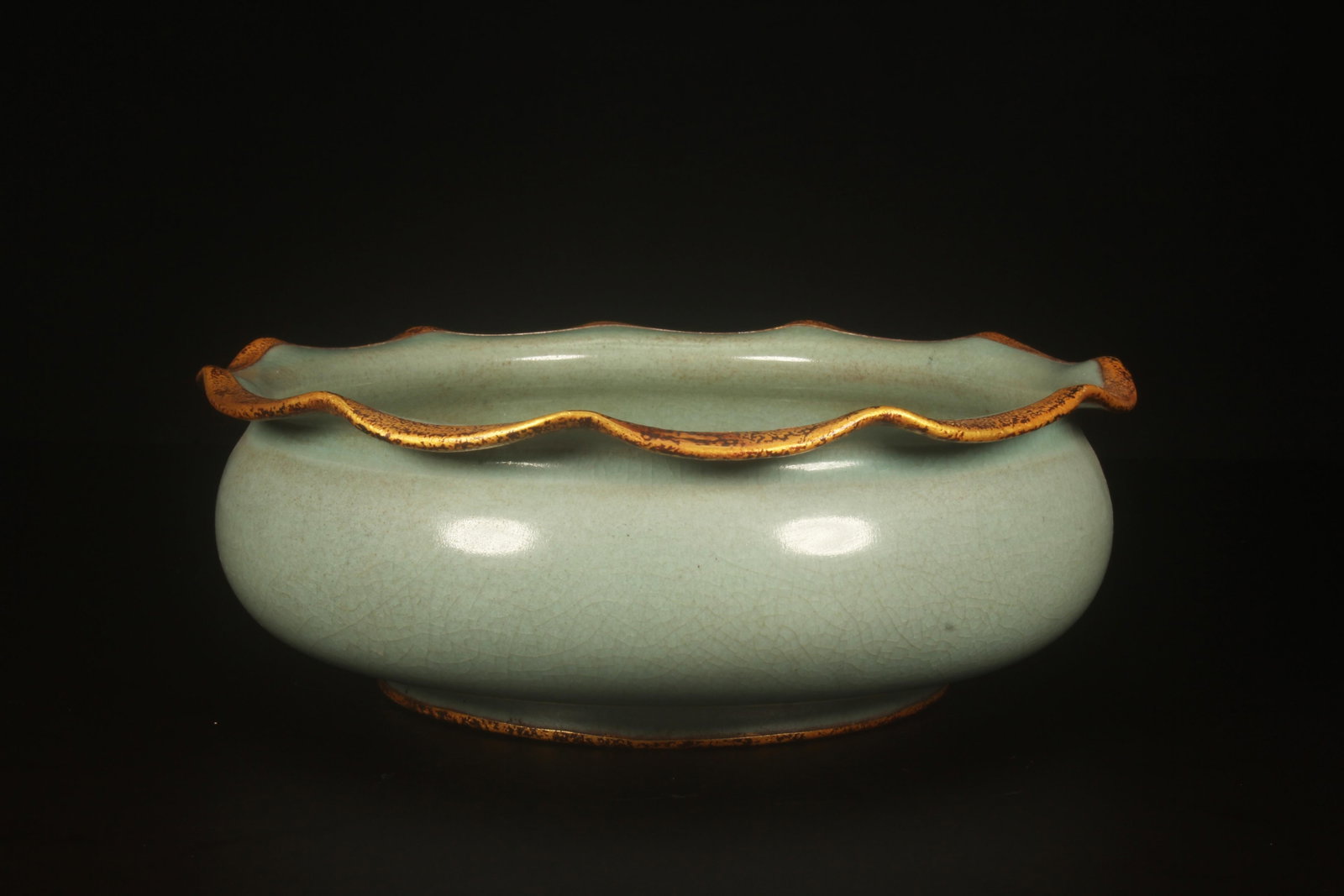 A Ruyao Incense Burner: A Ruyao Incense Burner. Dimensions: 7.5" x 2.6".