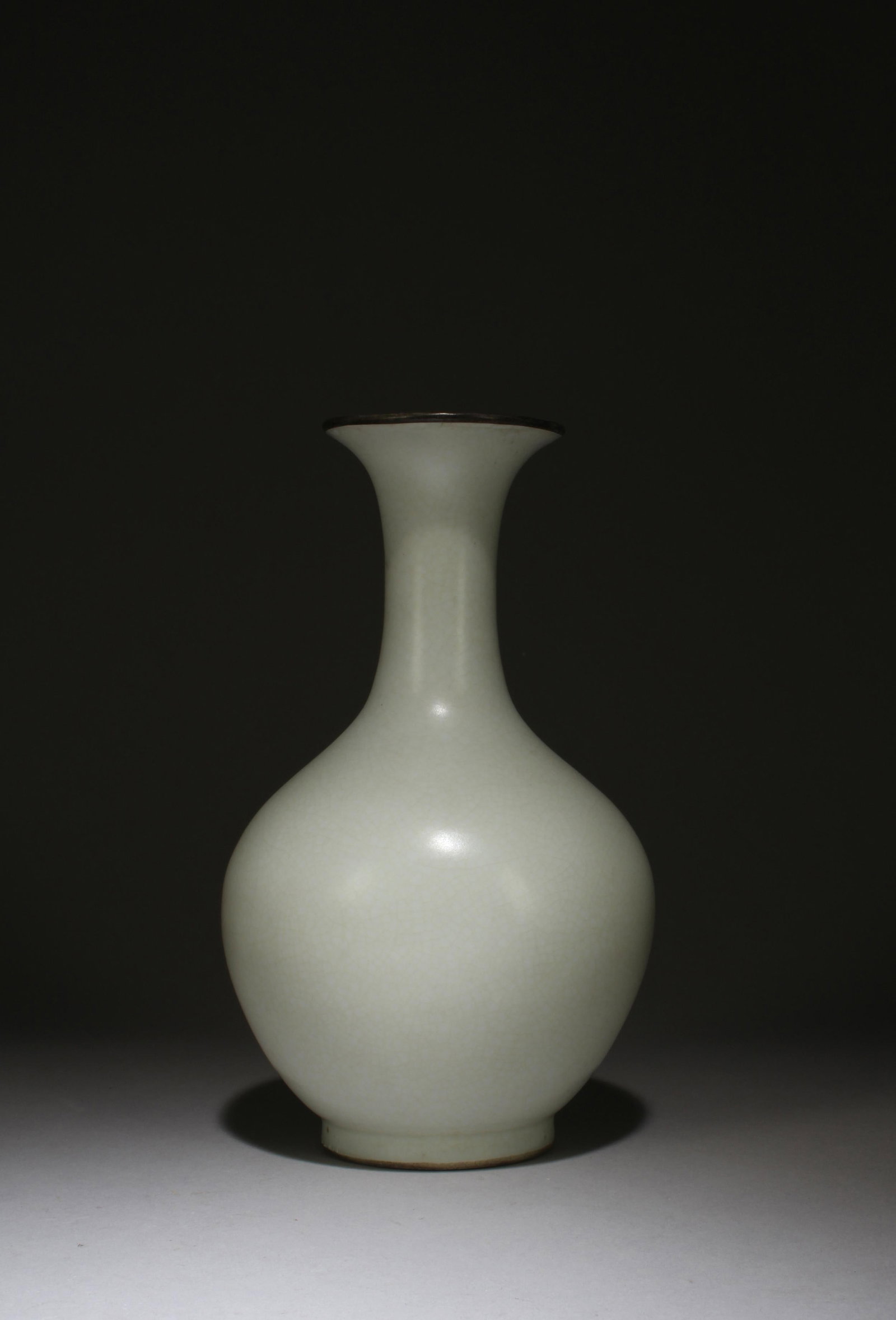 A Porcelain Vase: A Porcelain Vase, mouth rim with bronze lining. Height: 8.66in. Diameter: 4.72in.