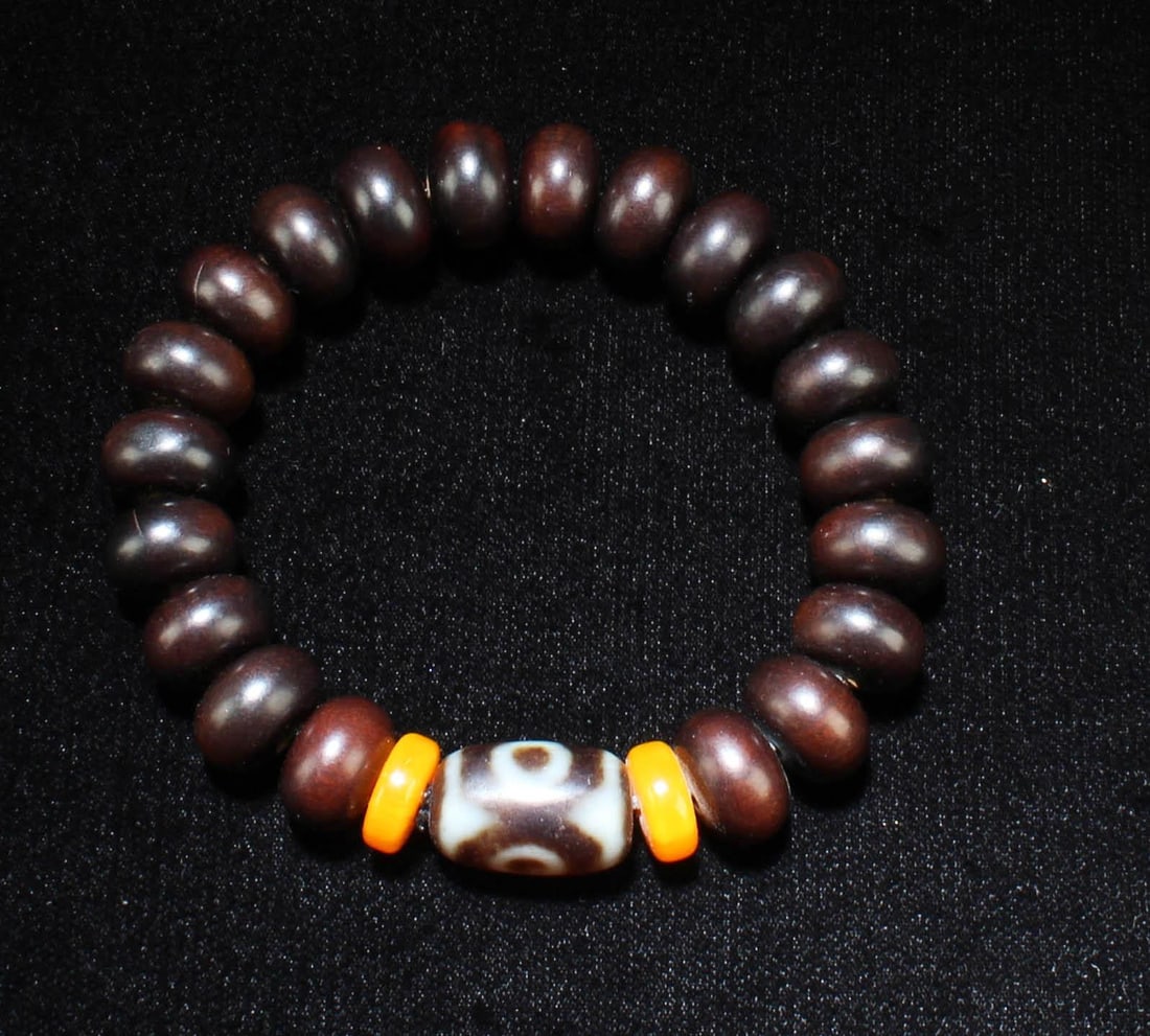A Dzi Bead Bracelet: A Dzi Bead Bracelet. Length: 0.75" (Dzi)