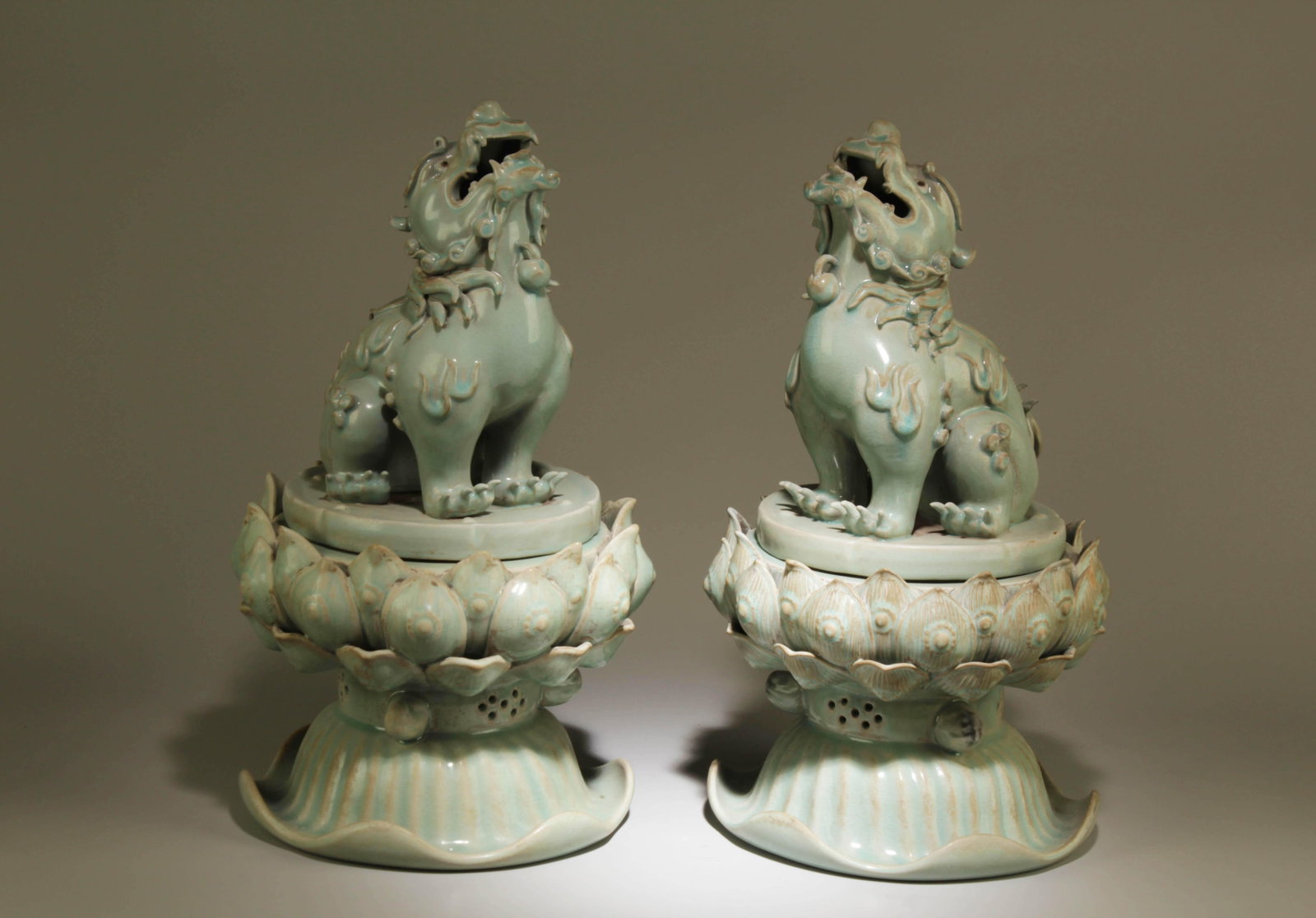 A Pair of Ruyao Qilin Incenes Burners: A Pair of Ruyao Qilin Incenes Burners. Dimensions: 11.5" x 17".