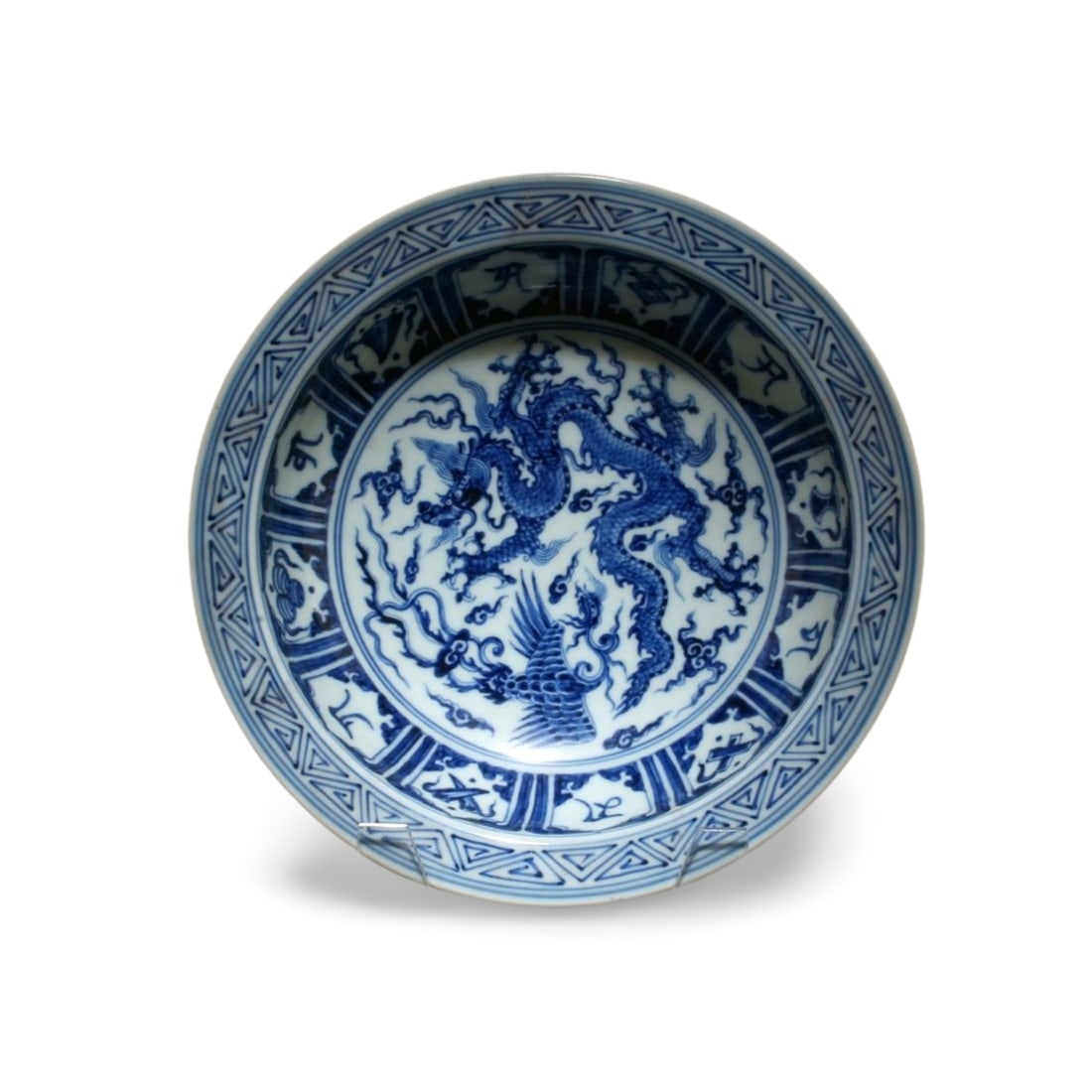 A Blue and White Plate: A Blue and White Plate. Dimension: 10.7" x 3.5".