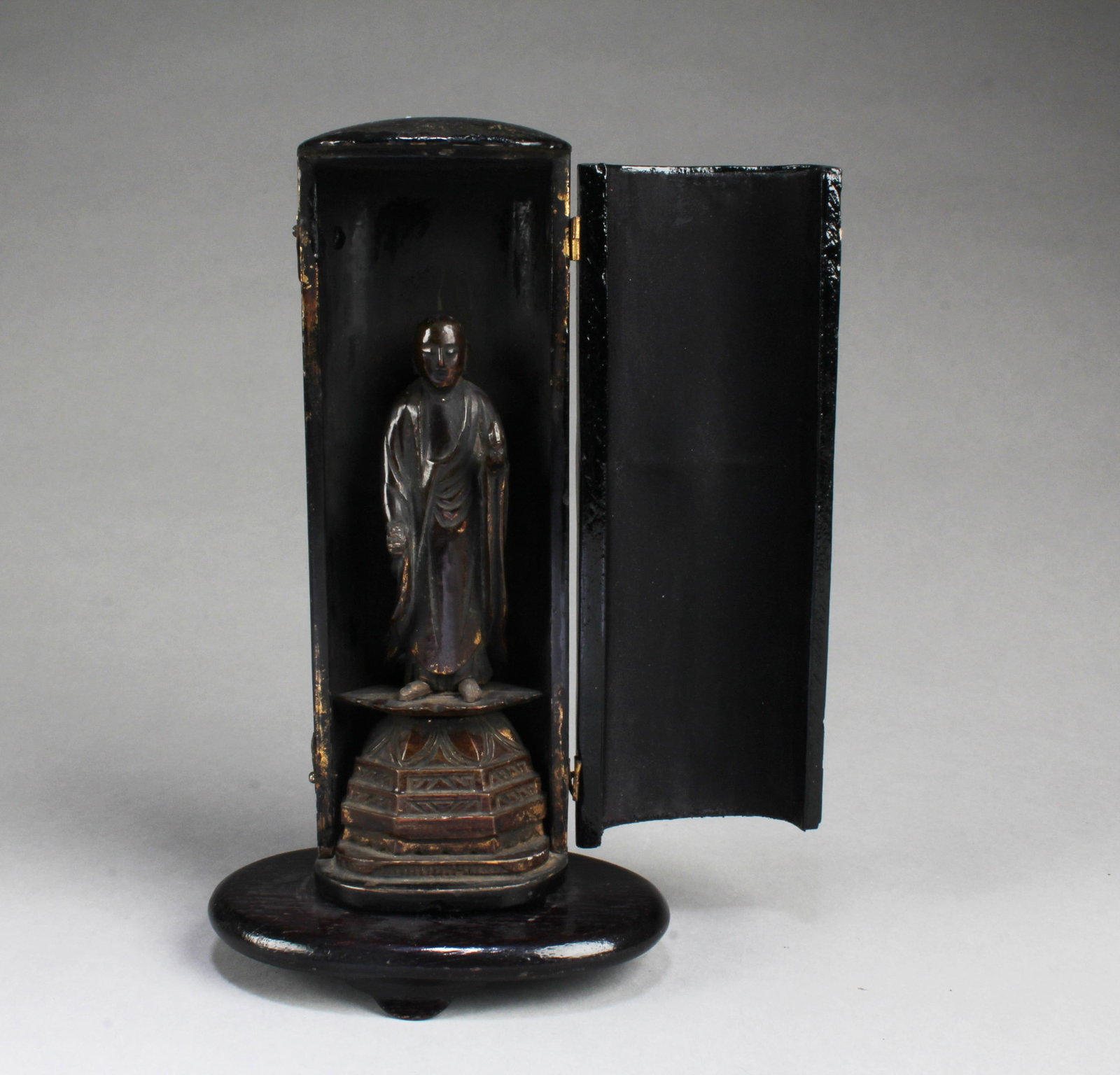Antique Carved Wooden Buddha Statue: Antique Carved Wooden Buddha Statue with Cabinet, with a wooden stand. Height: 8.5"