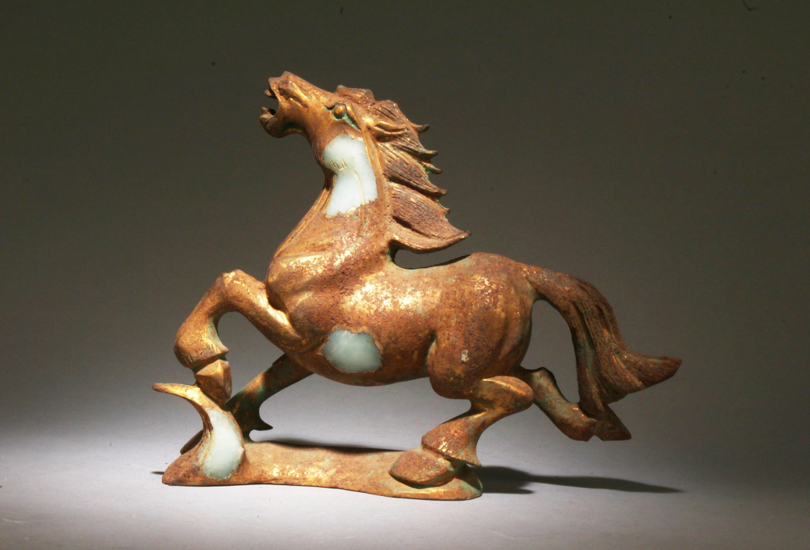 A Jade Horse Ornament: A Jade Horse Ornament. Dimensions: 8.5" x 10.5" x 3".