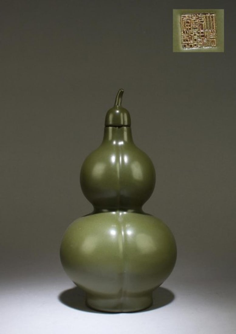 A Teadust Color Porcelain Double Gourd Vase: A Teadust Color Porcelain Double Gourd Vase with lid. "QianLong" mark at base. Height: 12"