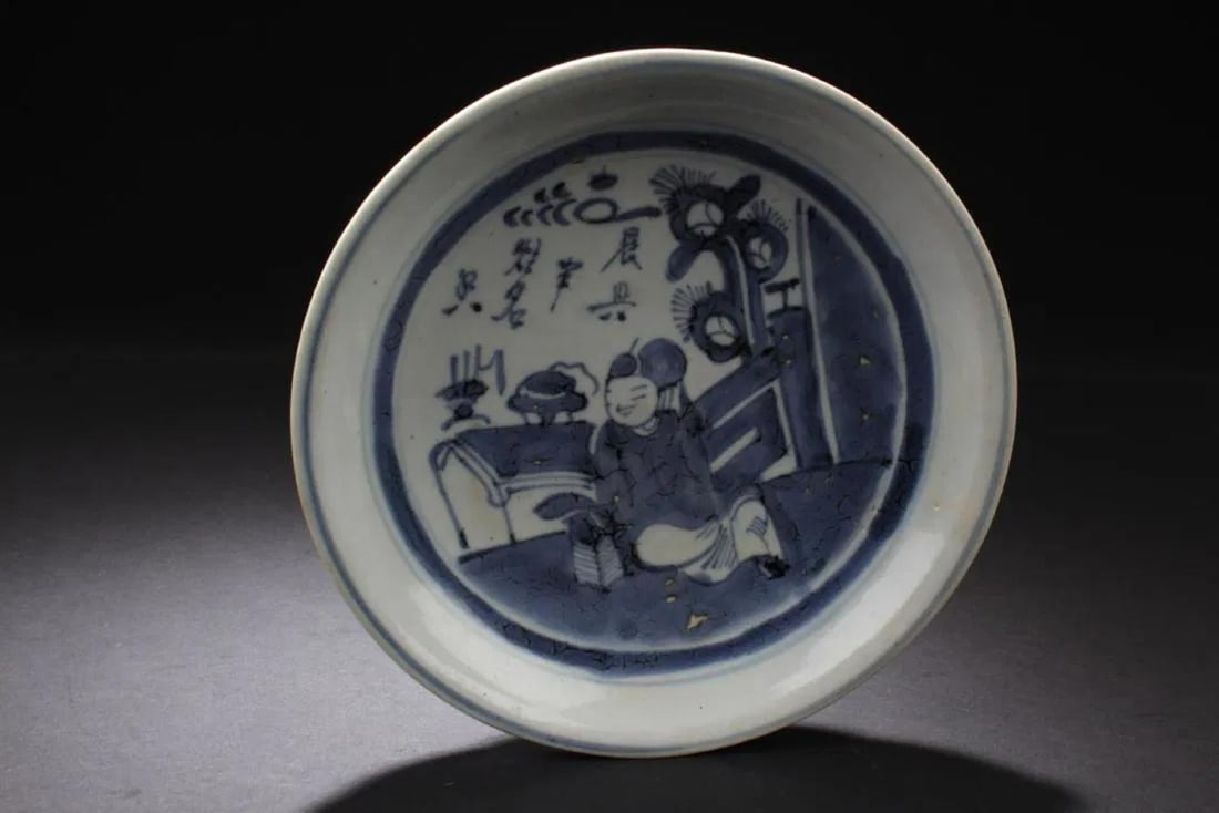 Antique Chinese Blue and White Plate: Antique Chinese blue and white porcelain plate, shallow dish with center painted image of a figure sitting reading books, with blue borders, signature and mark on base. Diameter: 7 in