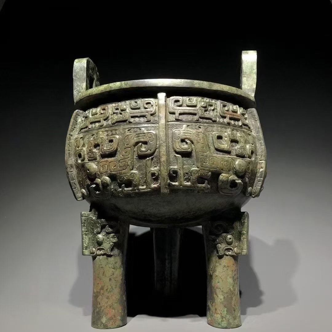 A Bronze Ding with Taotie Pattern: A Bronze Ding with Taotie Pattern. Dimensions: 10.63in x 10.24in x 14.57in; Weight: 41.90lbs.