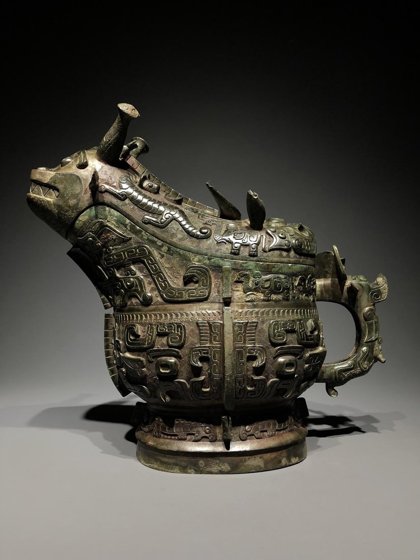 A Bronze Gong with Beast Mask: A Bronze Gong with Beast Mask. Dimensions: 14.96in x 7.48in x 13.39in; Weight: 29.76lbs.