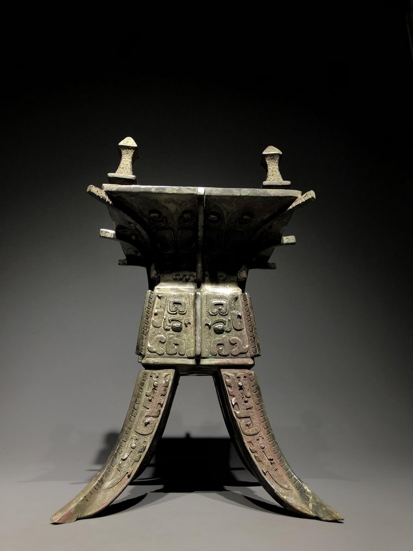 A Bronze Jue with Beast Mask: A Bronze Jue with Beast Mask. Dimensions: 9.06in x 8.66in x 16.14in; Weight: 30.86lbs.