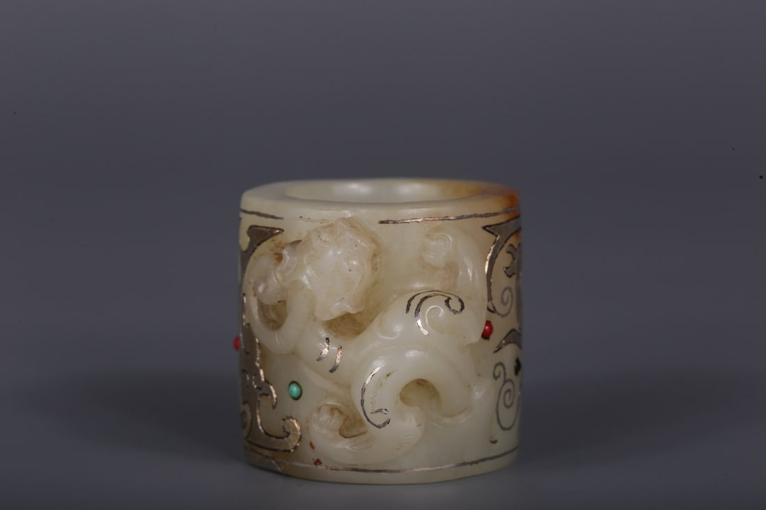 A Hetian White Jade Inlaid Gold Dragon Thumb Ring: A Hetian White Jade Inlaid Gold Dragon Thumb Ring. Height: 1.26in; Diameter: 1.26in; Weight: 0.11lbs.