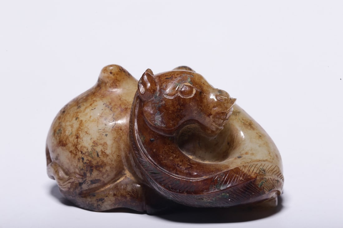 A Jade Camel Ornament: A Jade Camel Ornament. Dimensions: 2.17in x 3.82in x 2.76in; Weight: 1.04lbs.
