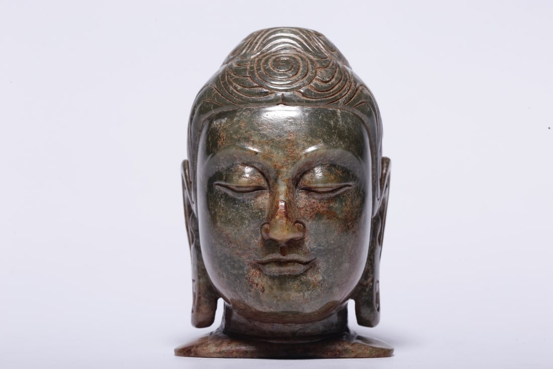 A Jade Shakyamuni Buddha Head Ornament: A Jade Shakyamuni Buddha Head Ornament. Dimensions: 3.54in x 2.28in x 2.56in; Weight: 1.02lbs.
