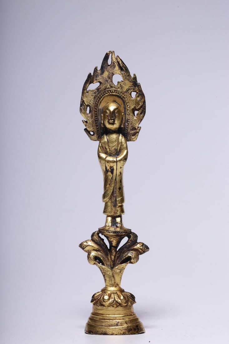 A Gilt Bronze Shakyamuni Buddha Statue: A Gilt Bronze Shakyamuni Buddha Statue. Dimensions: 4.72in x 1.10in x 1.10in; Weight: 0.24lbs.
