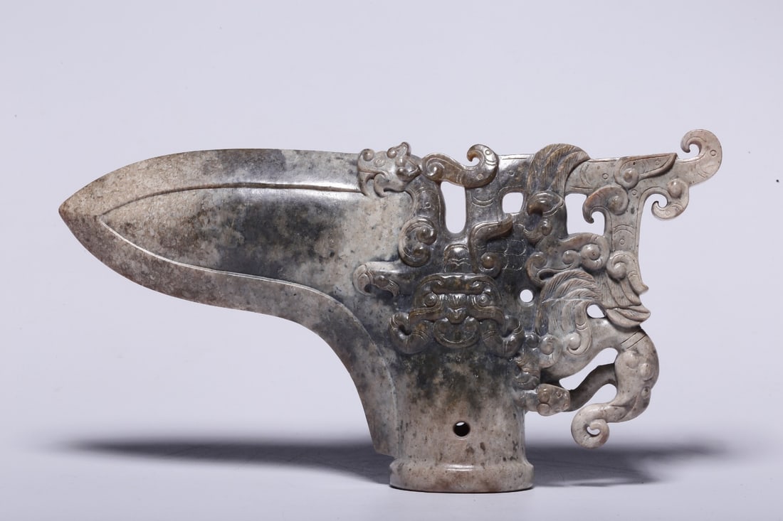 A Jade Dagger with Chilong and Taotie Pattern: A Jade Dagger with Chilong and Taotie Pattern. Dimensions: 3.54in x 6.57in x 1.38in; Weight: 0.68lbs.