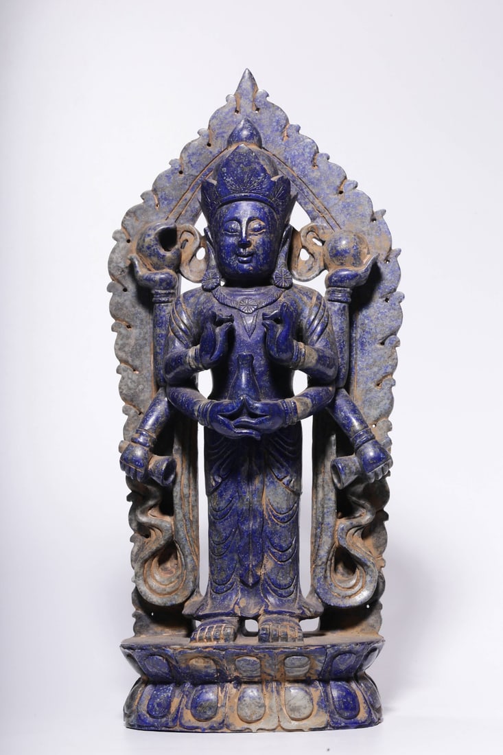 A Lapis Lazuli Eight-Armed Guanyin Statue: A Lapis Lazuli Eight-Armed Guanyin Statue. Dimensions: 12.99in x 5.91in x 3.15in; Weight: 6.89lbs.