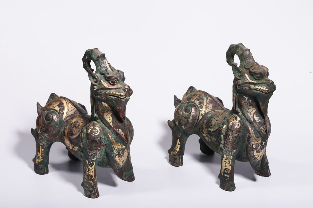 A Pair of Bronze Inlaid Gold and Silver Mythical Beast Ornaments: A Pair of Bronze Inlaid Gold and Silver Mythical Beast Ornaments. Dimensions: 9.06in x 7.87in x 3.94in; Weight: 4.71lbs.