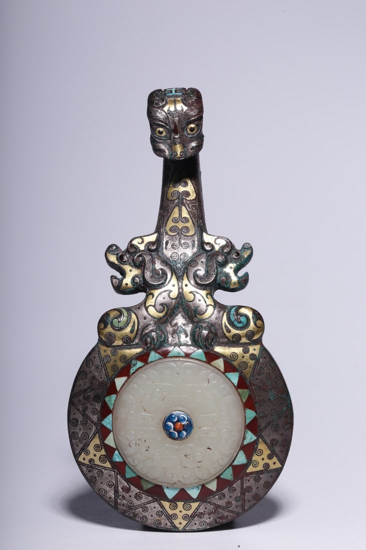 A Bronze Inlaid Gold and Silver Jade Chilong Belt Hook: A Bronze Inlaid Gold and Silver Jade Chilong Belt Hook. Dimensions: 1.38in x 6.69in x 3.35in; Weight: 1.24lbs.