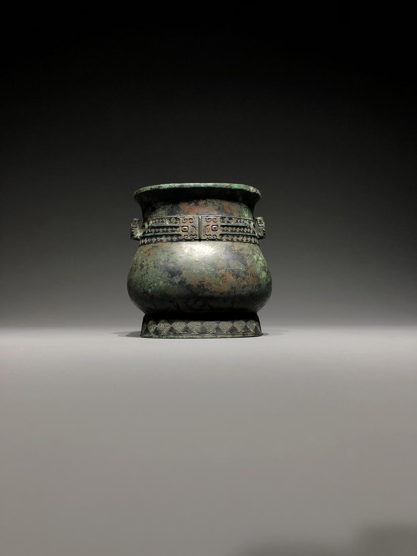 A Bronze Zhi with Beast Mask: A Bronze Zhi with Beast Mask. Dimensions: 7.87in x 3.35in x 5.12in; Weight: 4.63lbs.