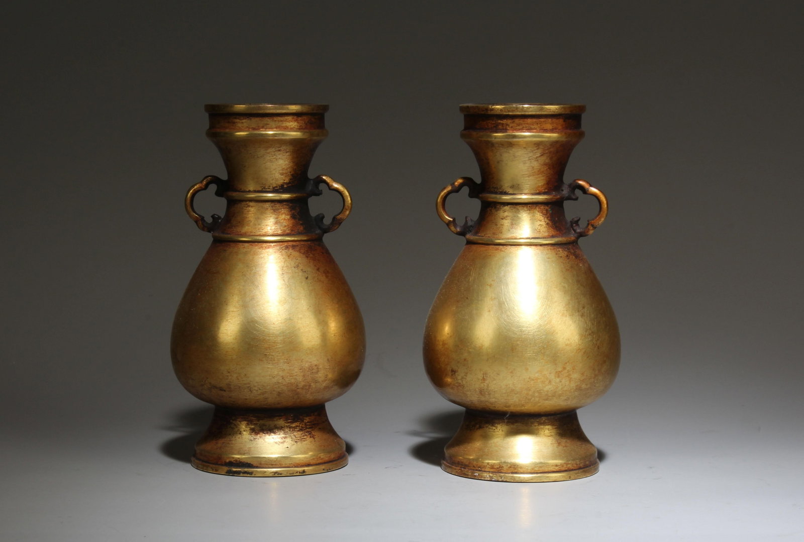 A Pair of Gilt Bronze Vase: A Guan Ware Moon-White Glazed Vase With Gilt Mount. A Guan Ware Moon-White Glazed Vase With Gilt Mount. Height: 9.25in; Diameter: 7.28in.
