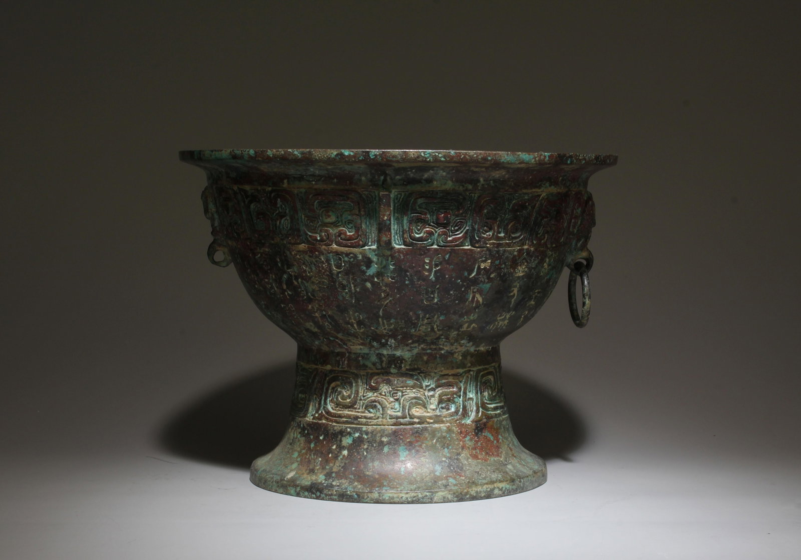 A Bronze Incense Burner: A Guan Ware Celadon Goose-Neck Vase. A Guan Ware Celadon Goose-Neck Vase. Height: 9.37in; Diameter: 5.63in.