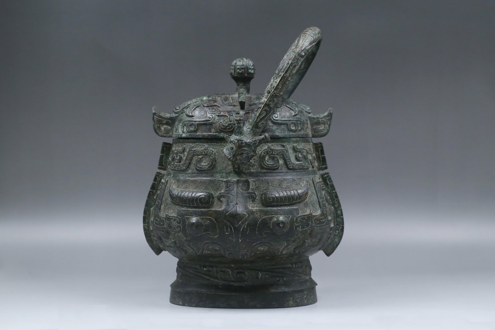 A Bronze Vessel: A Guan Ware Celadon Vase With Gilt Mount. A Guan Ware Celadon Vase With Gilt Mount. Dimensions: 9.84in x 5.32in.